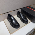 Prada Black Lug Sole Slip-On Shoes — hero